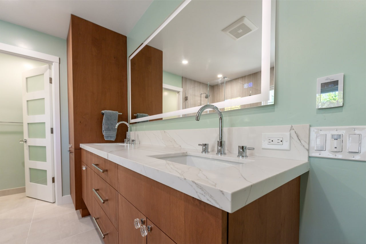 Contemporary bathroom remodeling in Los Gatos featuring custom wood vanity with white quartz countertops and undermount sinks